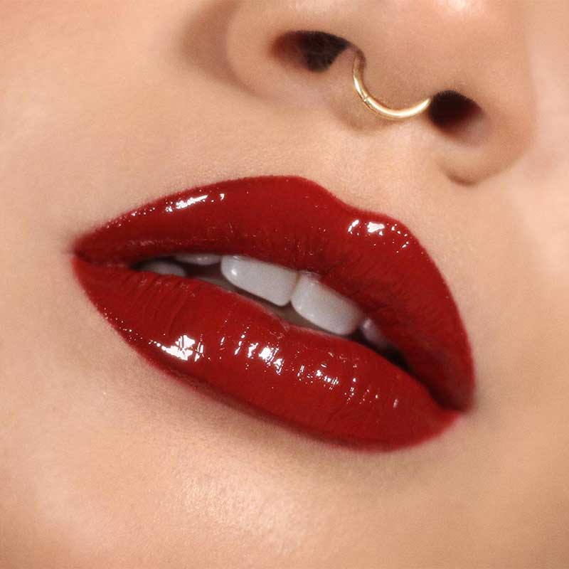 Brick red lipstick on lips
