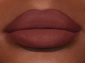 Carolina Herrera Red Obsession on lips, deep skin
