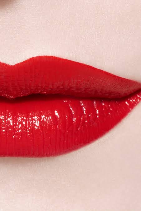 Chanel Rouge Coco Bloom 158 Bright red lipstick worn on skin