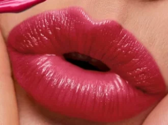 Revlon Cherries in the Snow, a cherry red lipstick, on lips