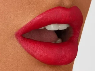 NARS Dragon Girl, a classic red lipstick, on lips