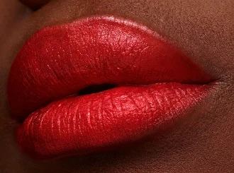 Revlon Fire & Ice, a fire-engine red lipstick, on lips