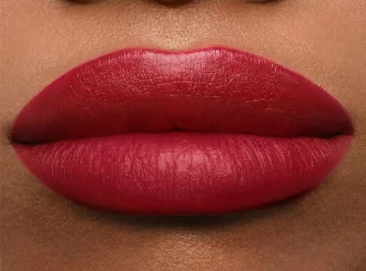 Givenchy Grenat Volontaire, a cherry red lipstick, on lips
