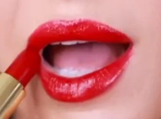 Chanel Pirate, a classic red lipstick, on lips