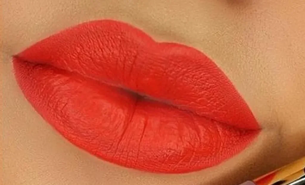 Poppy red lipstick on lips