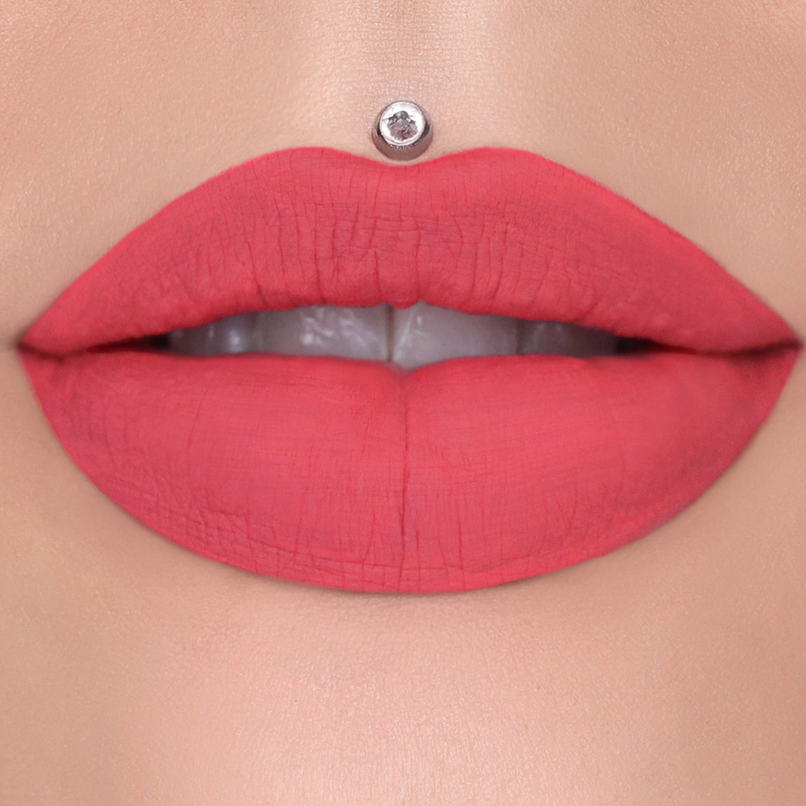 Raspberry red lipstick on lips