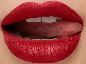 MAC Russian Red, an oxblood red lipstick, on lips