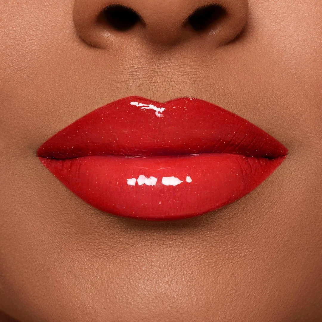 Tomato red lipstick on lips
