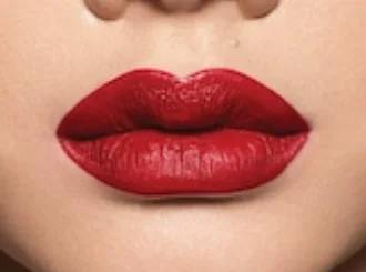 Fenty Beauty Stunna Lip Paint Uncensored, an opaque red, on light skin